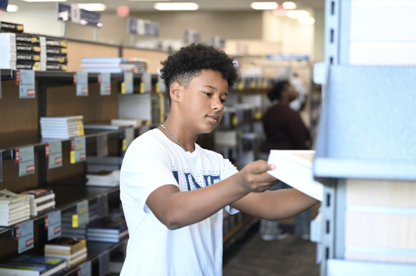 Cameron Robinson, a 13-year-old junior at UNF is at the UNF Bookstore. (Courtesy of UNF)